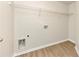 Laundry closet with wood-look flooring and shelving at 527 Firethorn Ct, Villa Rica, GA 30180