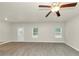 Spacious living room with wood-look floors and neutral walls at 527 Firethorn Ct, Villa Rica, GA 30180