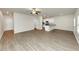 Open concept living area with kitchen and wood-look floors at 527 Firethorn Ct, Villa Rica, GA 30180