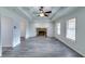 Living room with stone fireplace and gray vinyl flooring at 57 Poole Bridge, Hiram, GA 30141