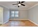Spacious bedroom featuring hardwood floors and large window at 1695 Bull Sw Run, Lilburn, GA 30047
