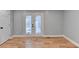 Spacious bedroom featuring hardwood floors and French doors at 1695 Bull Sw Run, Lilburn, GA 30047