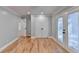 Well-lit bedroom with hardwood floors and double French doors at 1695 Bull Sw Run, Lilburn, GA 30047