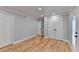 Roomy bedroom, hardwood floors, and double doors leading outside at 1695 Bull Sw Run, Lilburn, GA 30047