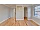 Spacious bedroom with hardwood floors and access to closets at 1695 Bull Sw Run, Lilburn, GA 30047