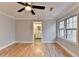 Well-lit bedroom, hardwood floors and ensuite bathroom at 1695 Bull Sw Run, Lilburn, GA 30047