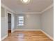 Bright bedroom, hardwood floors, and window with wooded view at 1695 Bull Sw Run, Lilburn, GA 30047