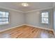 Charming bedroom with hardwood floors and multiple windows at 1695 Bull Sw Run, Lilburn, GA 30047