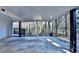 Covered patio provides extra outdoor space and wooded views at 1695 Bull Sw Run, Lilburn, GA 30047