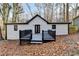 White house with black deck and wooded area at 1695 Bull Sw Run, Lilburn, GA 30047