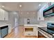 Open concept kitchen with island and stainless steel appliances at 1695 Bull Sw Run, Lilburn, GA 30047