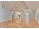 Open concept living room and kitchen with hardwood floors and vaulted ceilings at 1695 Bull Sw Run, Lilburn, GA 30047