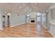 Spacious living room featuring hardwood floors, a stone fireplace, and vaulted ceilings at 1695 Bull Sw Run, Lilburn, GA 30047