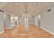 Open concept living room and kitchen with hardwood floors and vaulted ceilings at 1695 Bull Sw Run, Lilburn, GA 30047