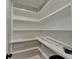 Walk-in pantry with ample shelving for storage at 1695 Bull Sw Run, Lilburn, GA 30047