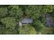 Aerial view of a single-story house nestled among lush trees at 131 Brookwood Sw Dr, Marietta, GA 30064