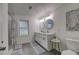 Modern bathroom with double vanity and tile floor at 131 Brookwood Sw Dr, Marietta, GA 30064