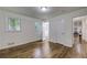 Well-lit bedroom featuring hardwood floors and an en-suite bathroom at 131 Brookwood Sw Dr, Marietta, GA 30064