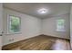 Well-lit bedroom featuring hardwood floors at 131 Brookwood Sw Dr, Marietta, GA 30064