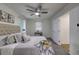 Charming bedroom with plush bed and ceiling fan at 131 Brookwood Sw Dr, Marietta, GA 30064