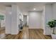 Bright hallway with hardwood floors and a console table, leading to other rooms at 131 Brookwood Sw Dr, Marietta, GA 30064