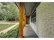 Covered side porch with wood columns offering a relaxing outdoor space at 131 Brookwood Sw Dr, Marietta, GA 30064