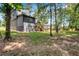 Large backyard with wooded area and a partially visible fence at 3483 Winter Chase Dr, Marietta, GA 30062