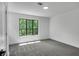 Simple bedroom with gray carpet and large window at 3483 Winter Chase Dr, Marietta, GA 30062