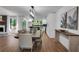 Bright dining room with hardwood floors and modern light fixture at 3483 Winter Chase Dr, Marietta, GA 30062