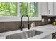 Modern kitchen sink with a black gooseneck faucet and white quartz countertop at 3483 Winter Chase Dr, Marietta, GA 30062