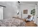 Bright main bedroom with barn door and wood floors at 3483 Winter Chase Dr, Marietta, GA 30062