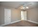 Bright bedroom featuring ceiling fan and ample closet space at 1444 Tether Ln, Mcdonough, GA 30253