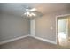 Spacious bedroom with ceiling fan and neutral walls at 1444 Tether Ln, Mcdonough, GA 30253