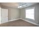 Well-lit bedroom, ceiling fan, window with blinds at 1444 Tether Ln, Mcdonough, GA 30253