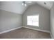 Spacious bedroom with ceiling fan and large window at 1444 Tether Ln, Mcdonough, GA 30253