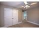 Bedroom with double doors and view of upper floor at 1444 Tether Ln, Mcdonough, GA 30253