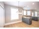 Bright dining area with hardwood floors and a chandelier at 1444 Tether Ln, Mcdonough, GA 30253