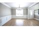 Bright dining room with hardwood floors and chandelier at 1444 Tether Ln, Mcdonough, GA 30253