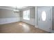 Bright dining room with hardwood floors and chandelier at 1444 Tether Ln, Mcdonough, GA 30253