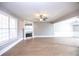 Spacious living room with fireplace and hardwood floors at 1444 Tether Ln, Mcdonough, GA 30253