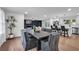 Open concept dining room with a large wooden table and gray chairs at 2873 Bob Bettis Rd, Marietta, GA 30066