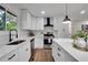 Modern kitchen with white cabinets, stainless steel appliances, and a large island at 2873 Bob Bettis Rd, Marietta, GA 30066