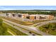 Aerial view of a large school building showing the school's location and parking lot at 6945 Melody Dr, Buford, GA 30518