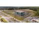 Aerial perspective showcasing a modern office building with ample parking and well-maintained landscaping at 6945 Melody Dr, Buford, GA 30518