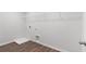 Laundry room with wire shelving and vinyl flooring at 6949 Melody Dr, Buford, GA 30518