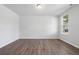 Large living room featuring hardwood floors and a window at 6949 Melody Dr, Buford, GA 30518