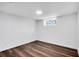 Spacious basement room with wood-look flooring and large window at 1536 Daffodil Dr, Marietta, GA 30062