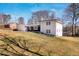 House exterior, white brick, dark trim, grassy yard at 1536 Daffodil Dr, Marietta, GA 30062