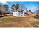 Side view of house, white brick, grassy yard at 1536 Daffodil Dr, Marietta, GA 30062