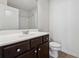 Clean bathroom with dark brown vanity and a shower/tub combo at 7633 Summer Berry Ln, Lithonia, GA 30038